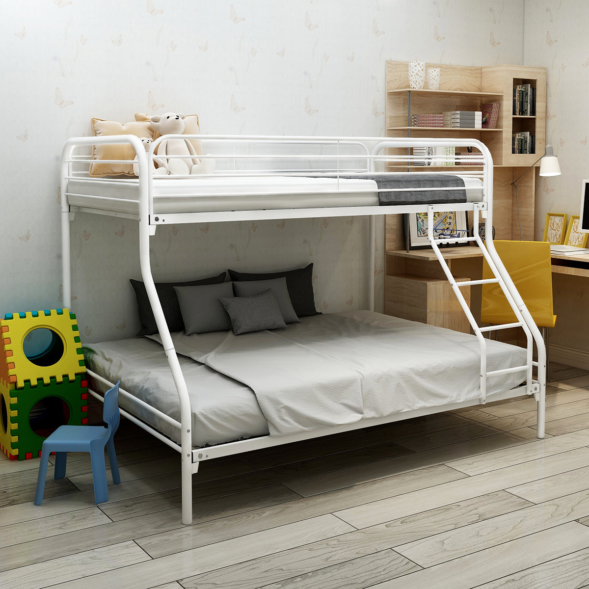 White metal bunk bed with twin over twin mattresses and gray bedding