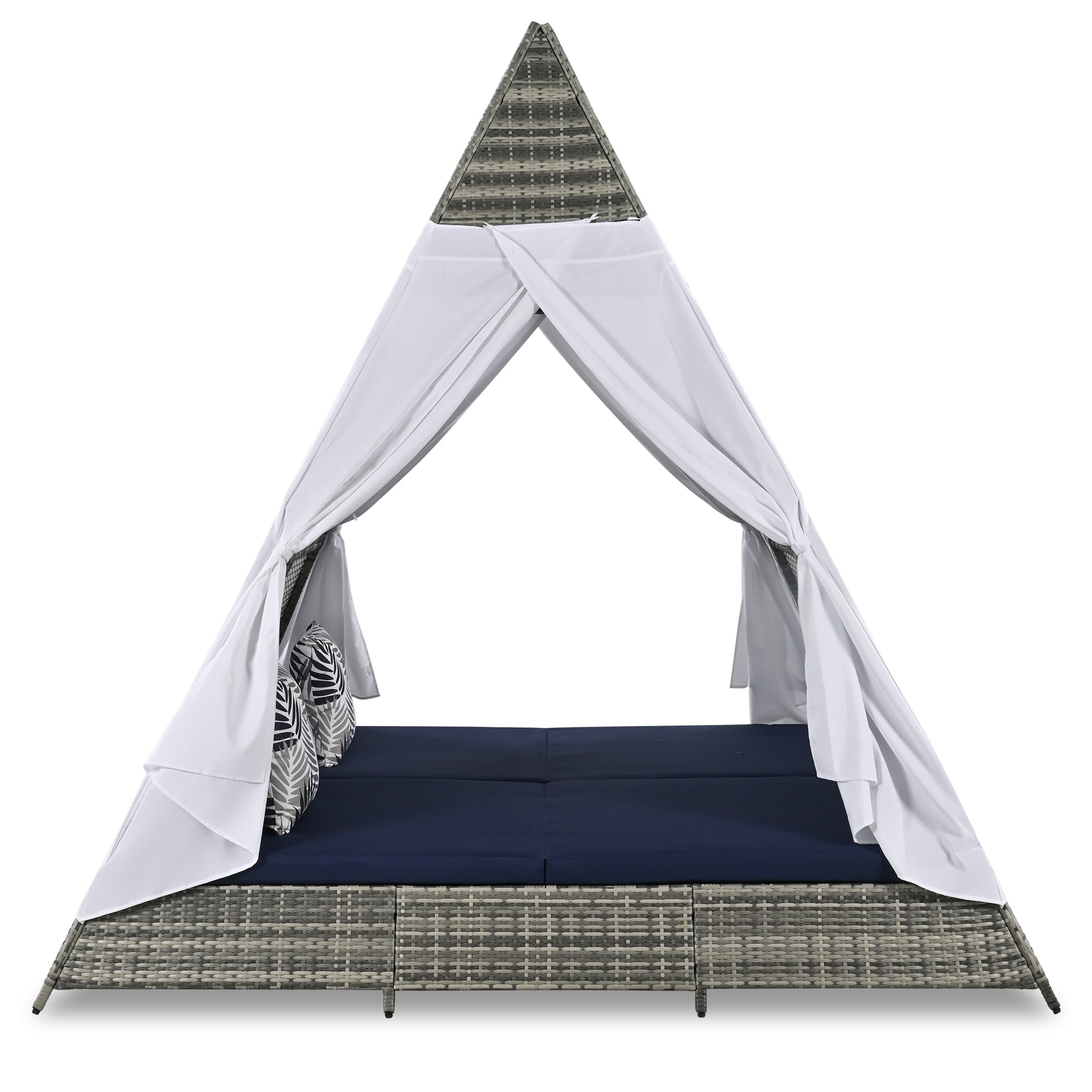 Gray rattan outdoor daybed with navy cushions and white canopy
