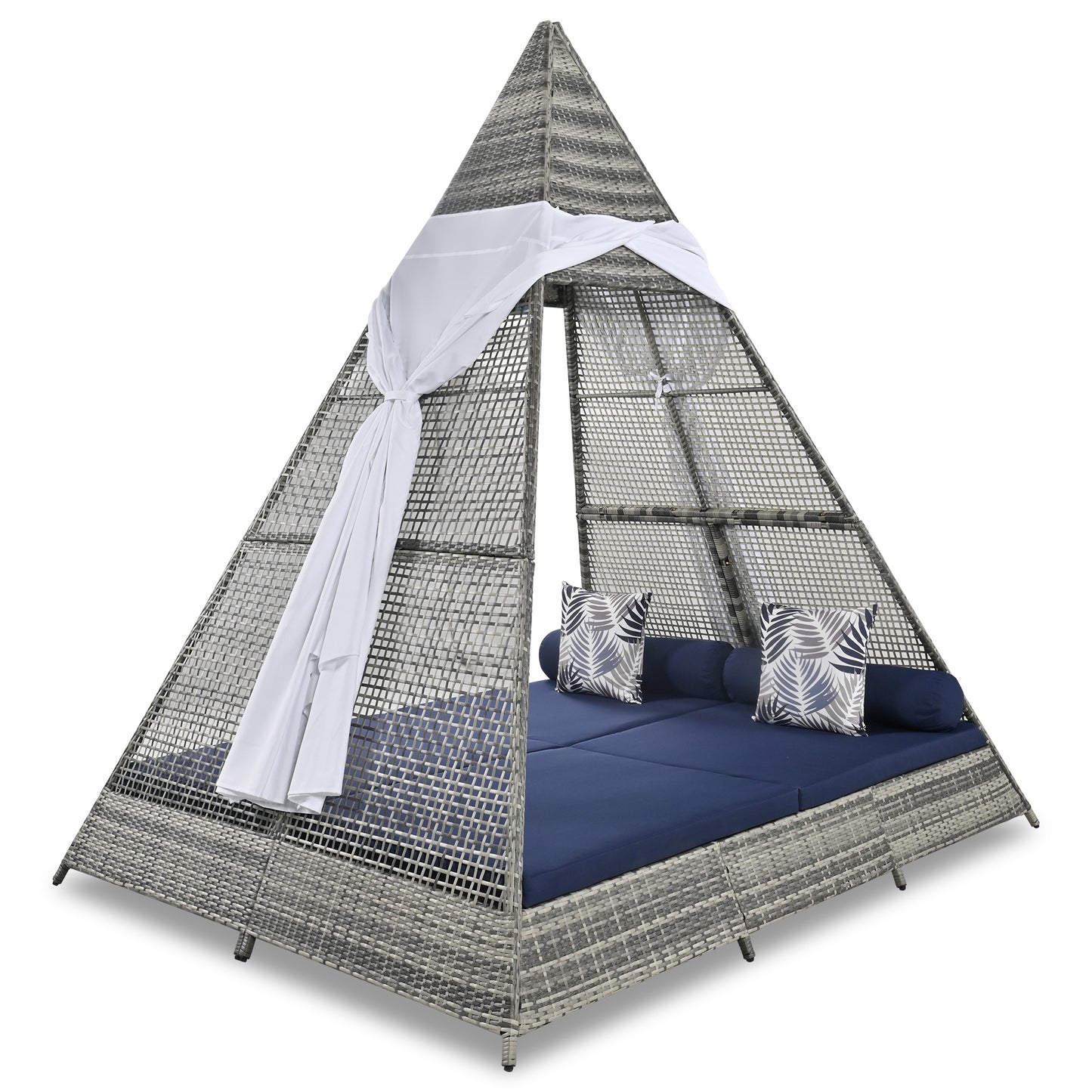 Gray wicker pyramid daybed with navy cushions and palm leaf pillows
