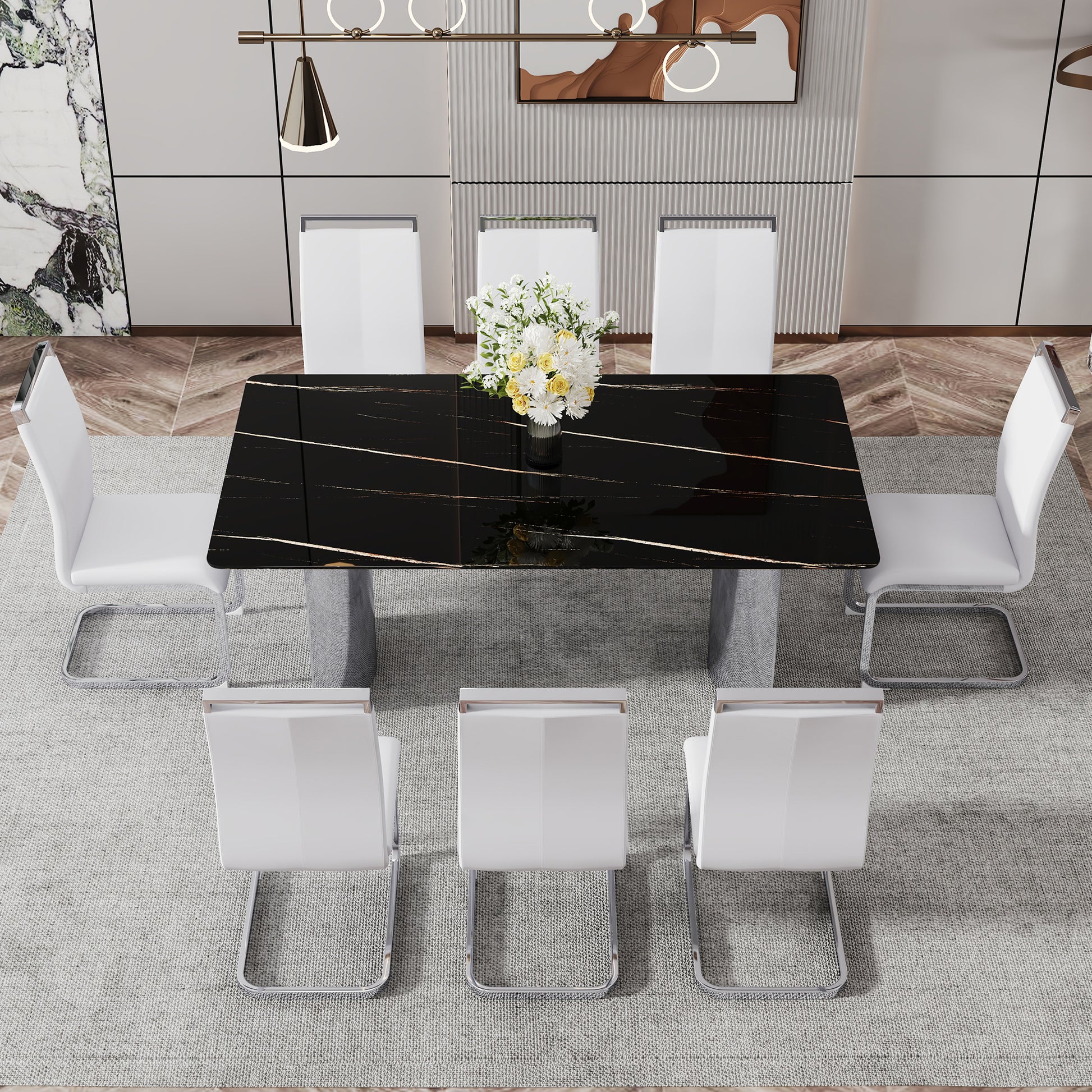 Black marble dining table with gold veining and white leather chairs