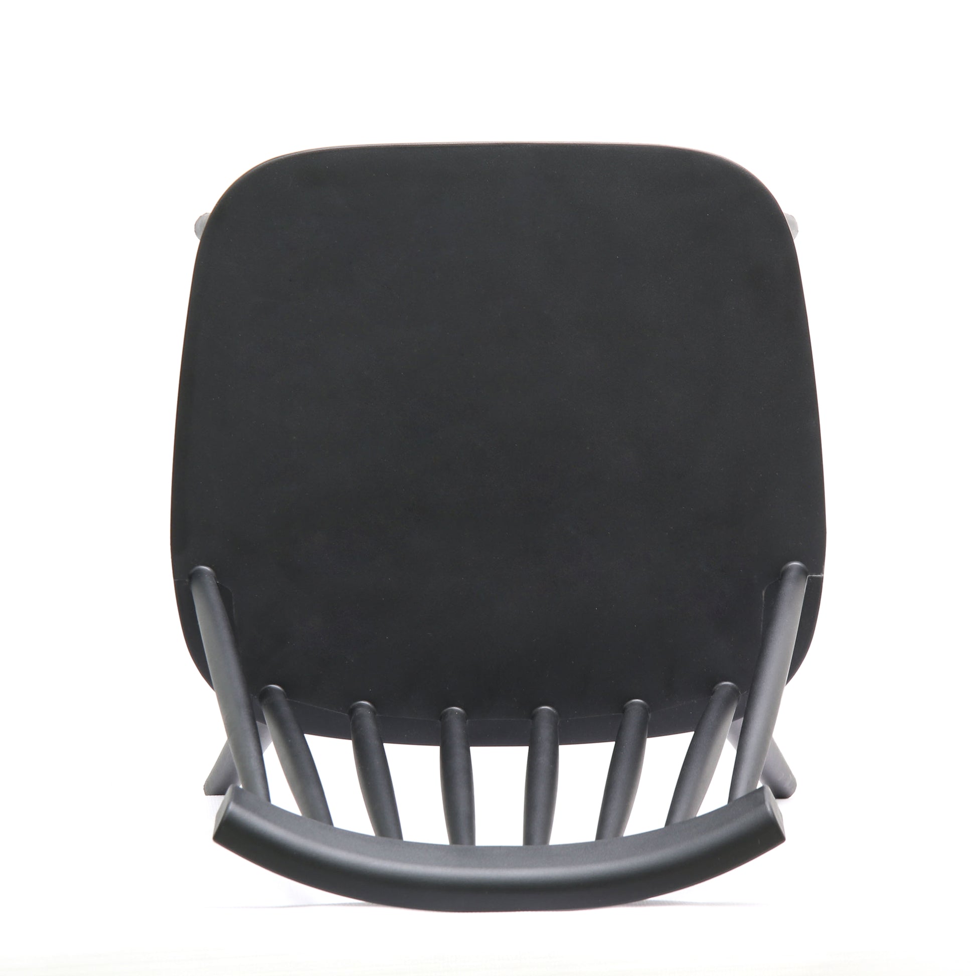 Black minimalist wooden chair with curved seat and spindle back