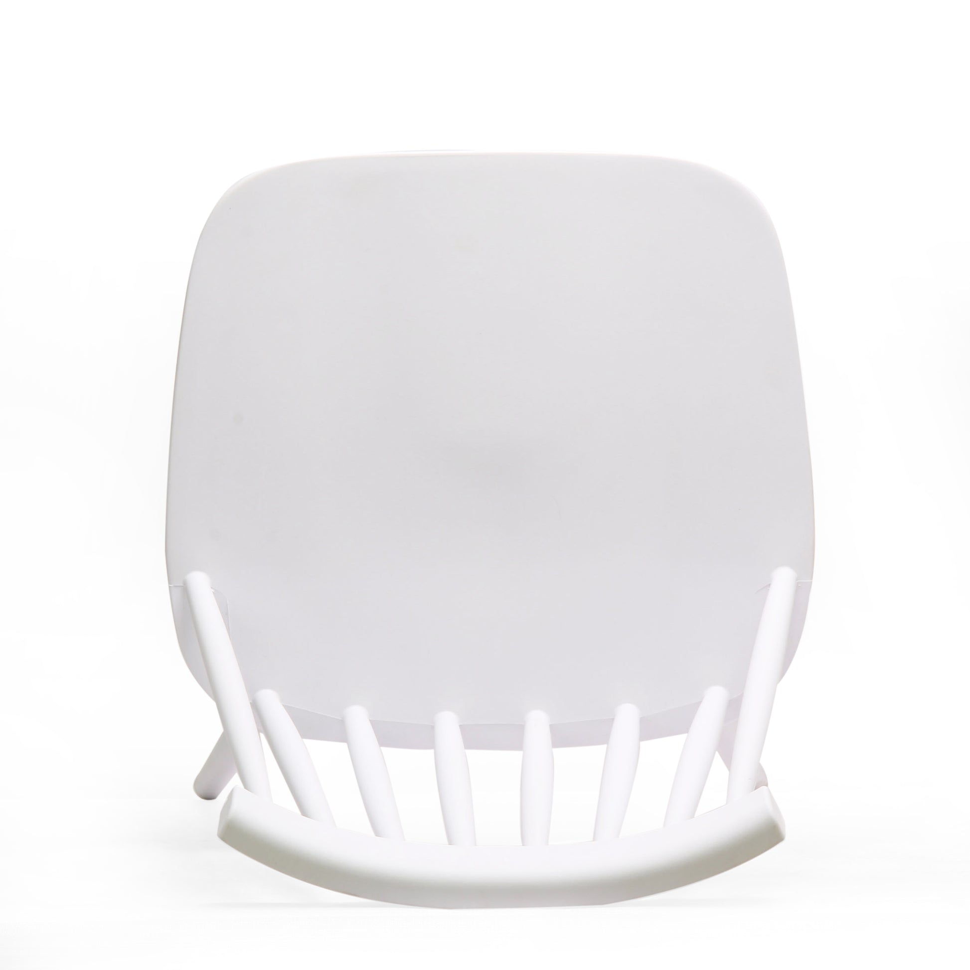 White modern dining chair with curved back and spindle legs
