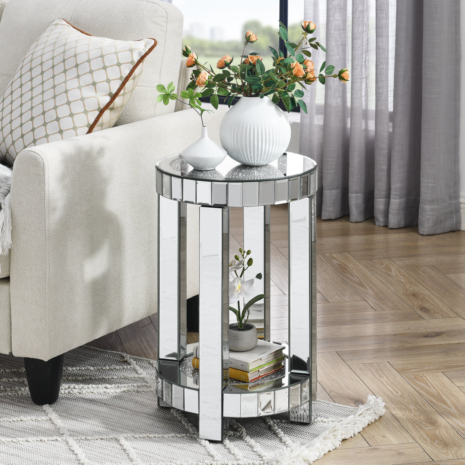 Round mirrored accent table with clear glass top and shelf