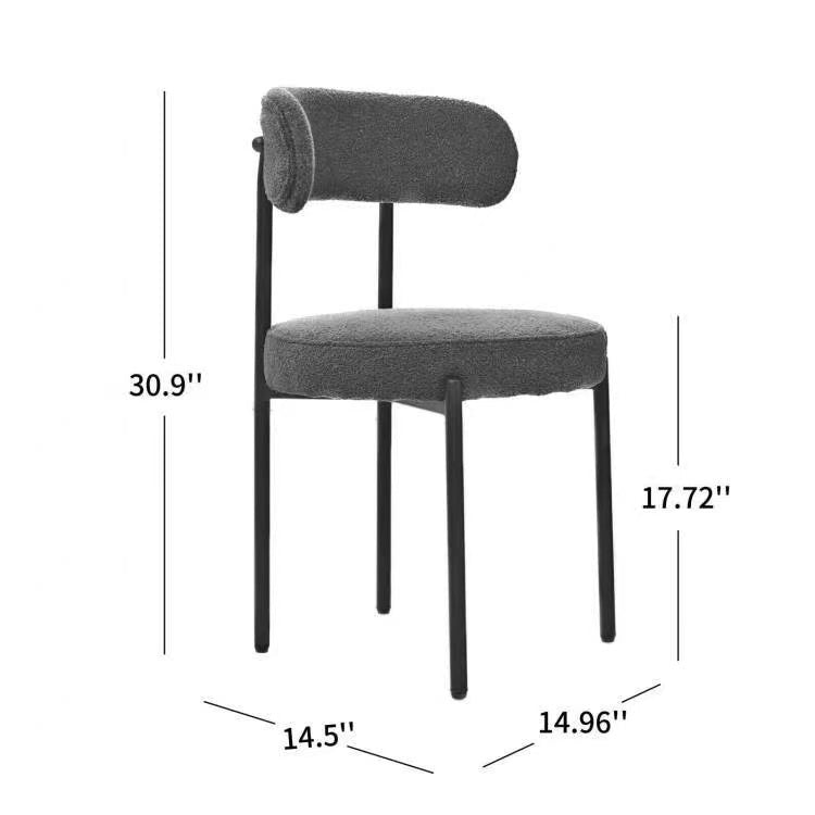 Dark gray boucle fabric accent chair with black metal legs and a curved backrest
