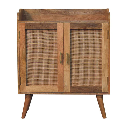 Rustic solid wood cabinet with cane panel doors and brass hardware