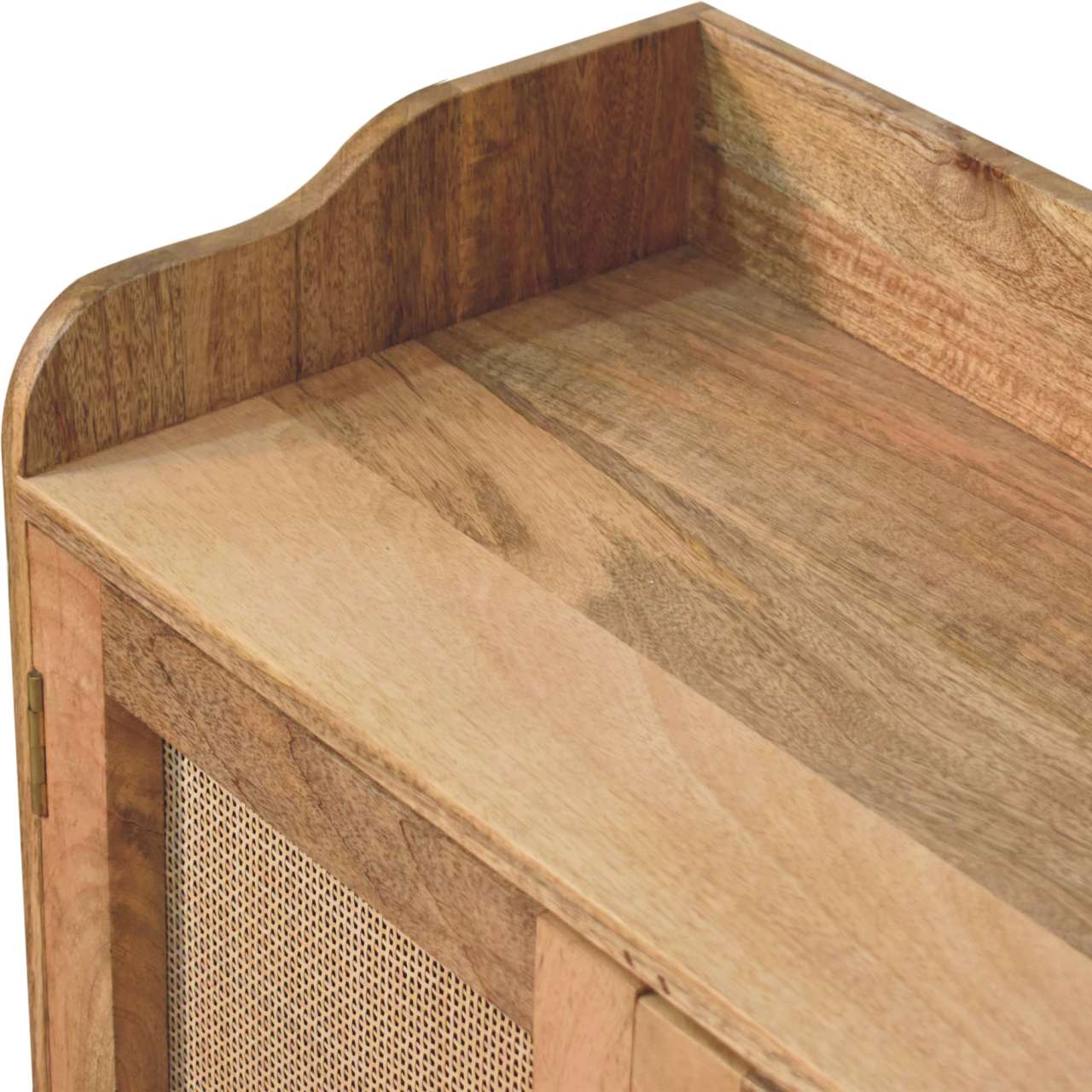 Closeup of light wood cabinet with cane door detail