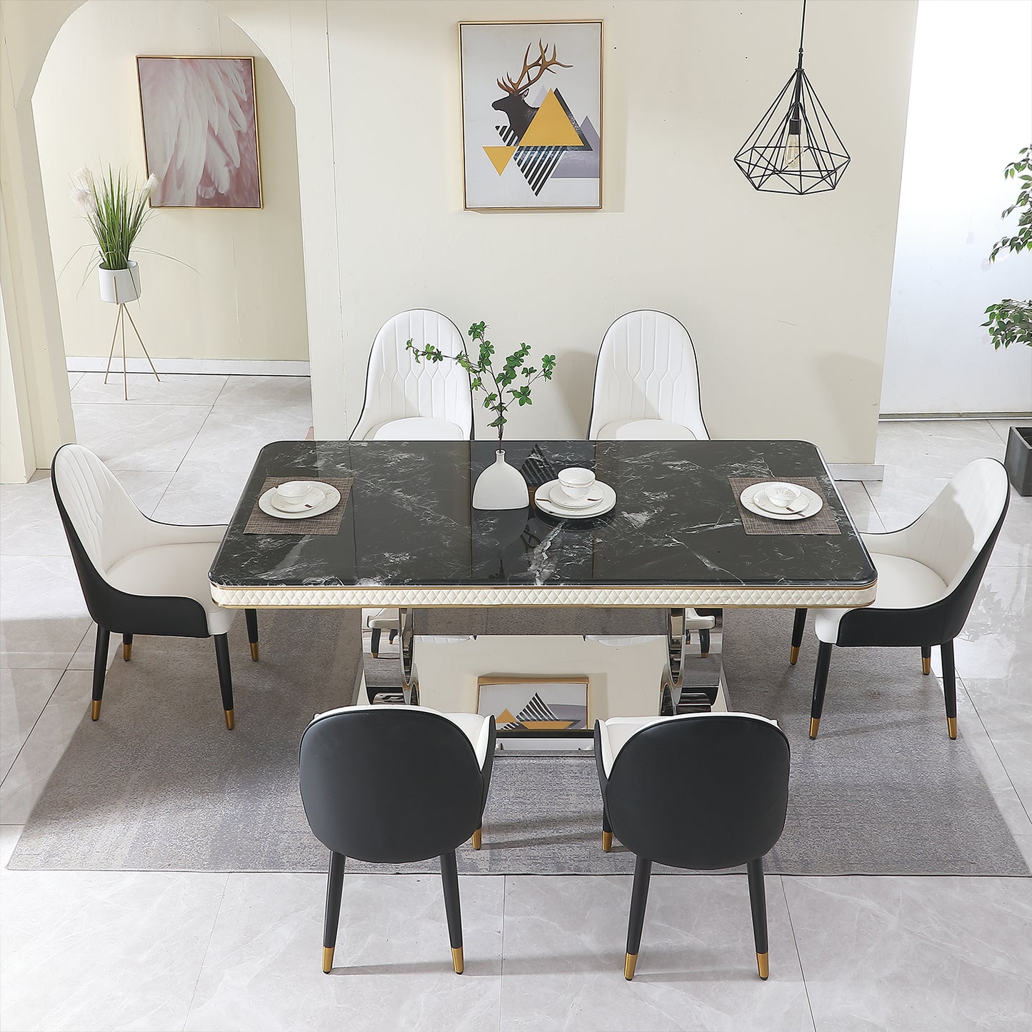Modern black marble dining table with white upholstered chairs