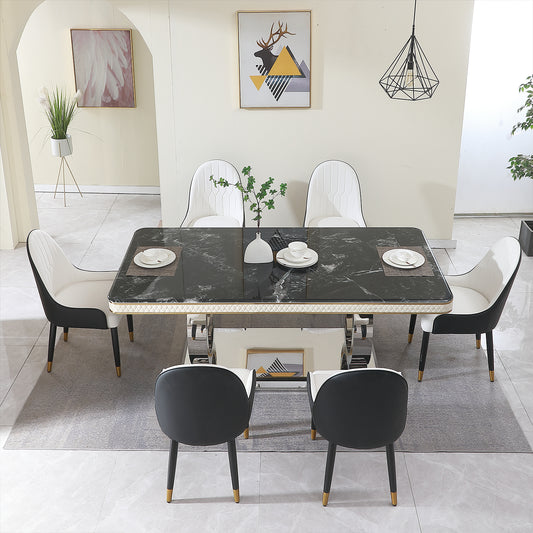 Modern black marble dining table with white upholstered chairs