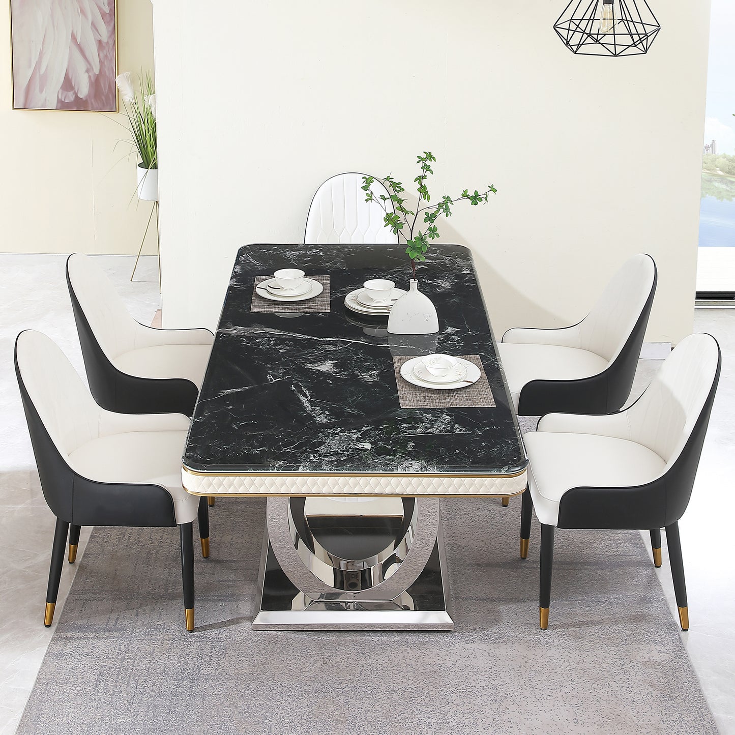 Black marble dining table set with white and black upholstered chairs