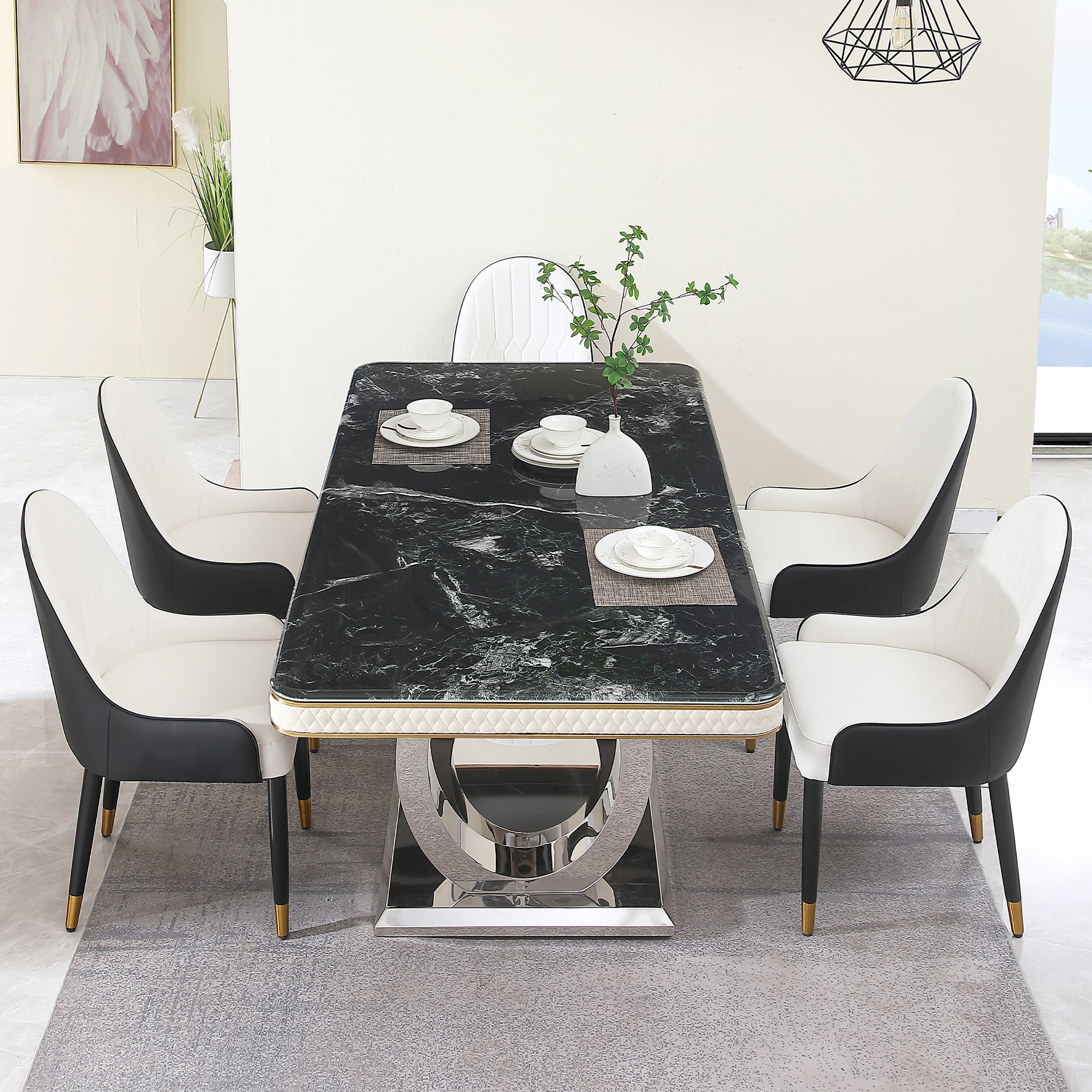 Black marble dining table set with white and black upholstered chairs