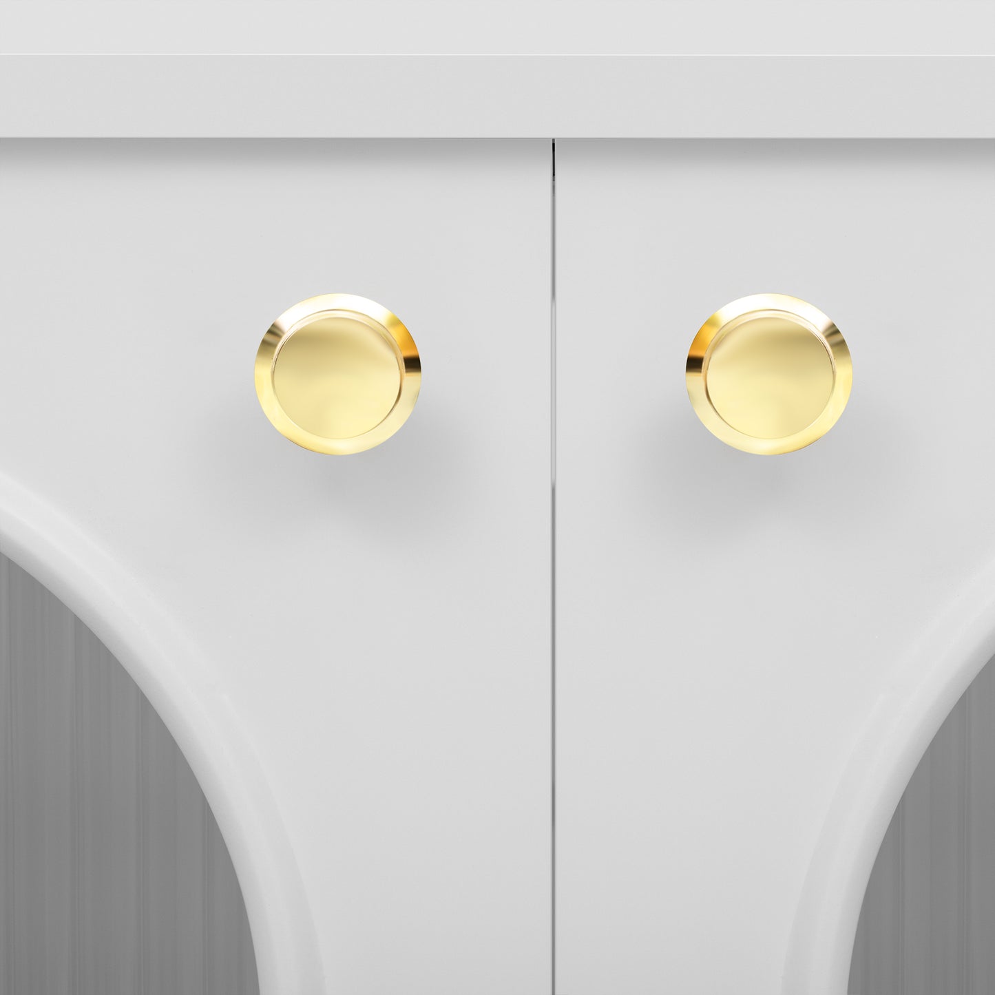 White cabinet doors with two polished gold round knobs