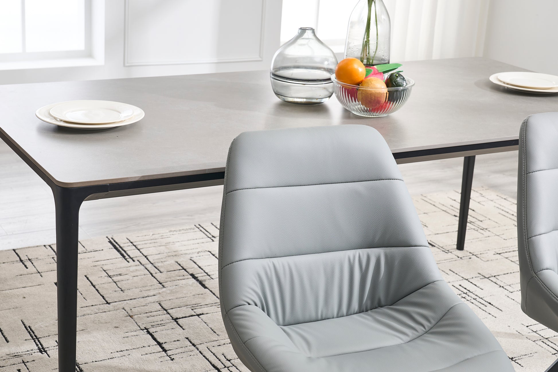 Gray upholstered dining chair with channel stitching