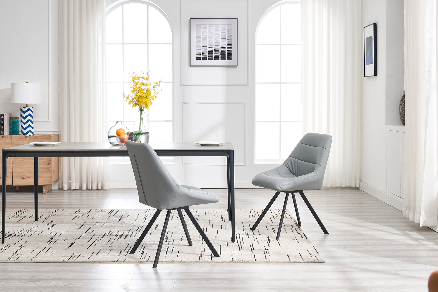 Grey upholstered dining chair with black metal legs