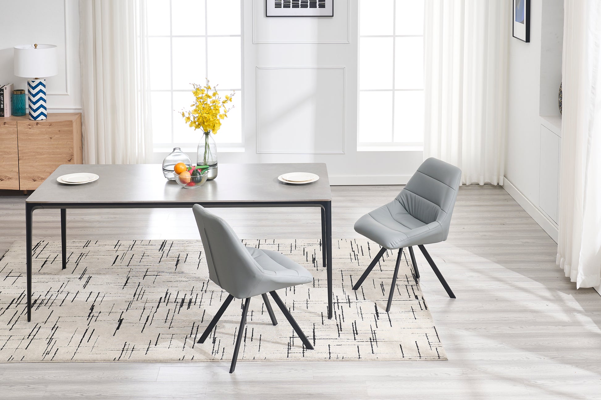Modern grey faux leather dining chair with black metal legs