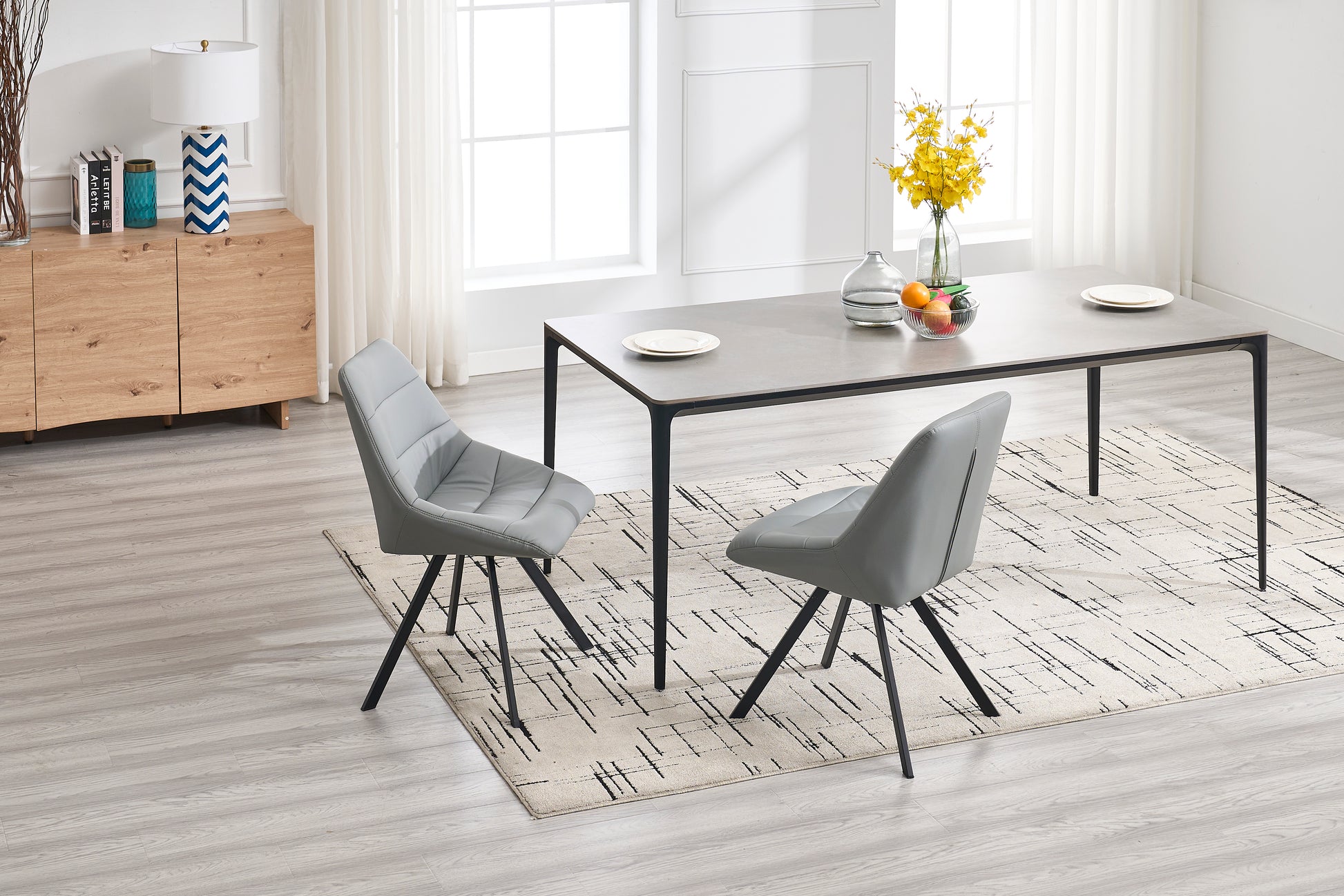 Modern gray upholstered dining chair with sleek black legs