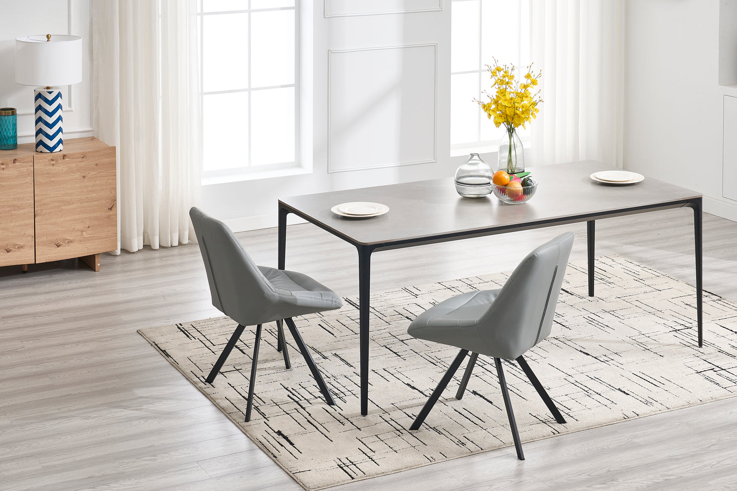 Modern gray faux leather dining chair with black metal legs