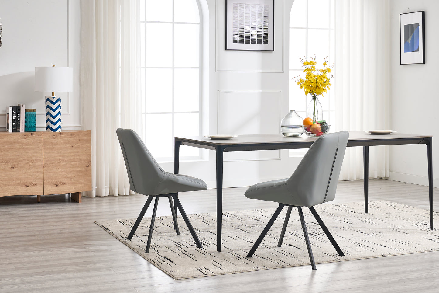 Modern grey upholstered dining chair with black metal legs