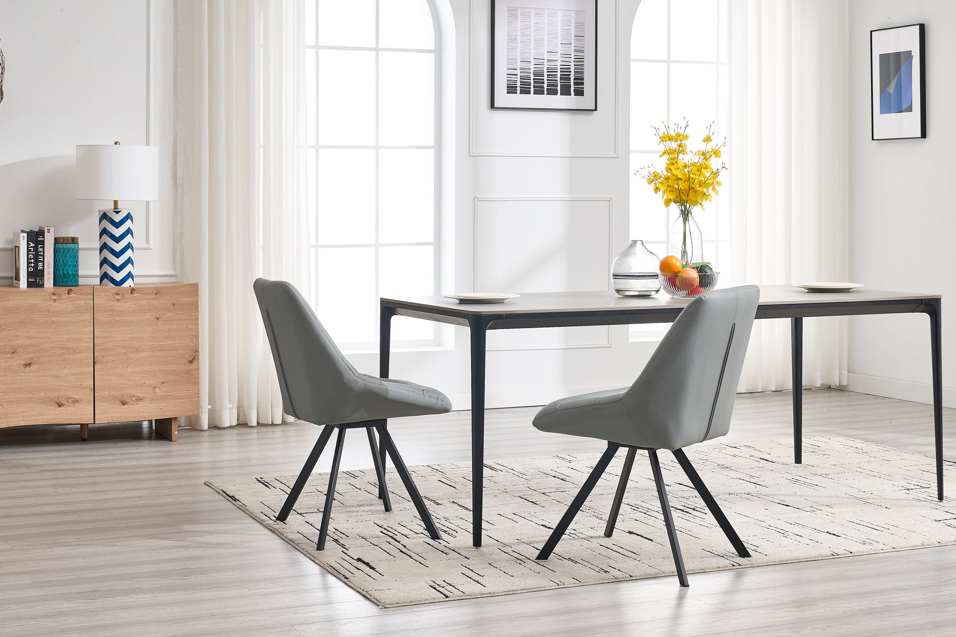Modern grey upholstered dining chair with black metal legs