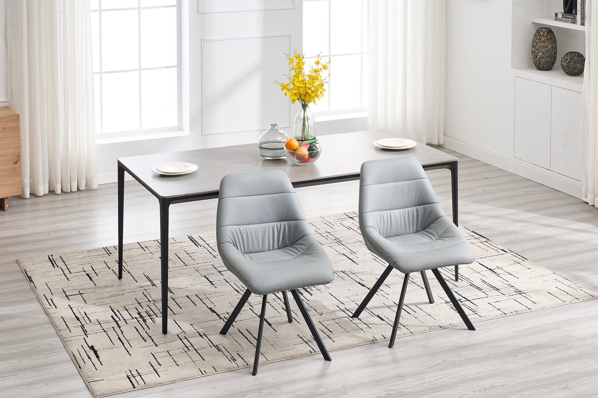 Modern gray faux leather dining chair with black metal legs