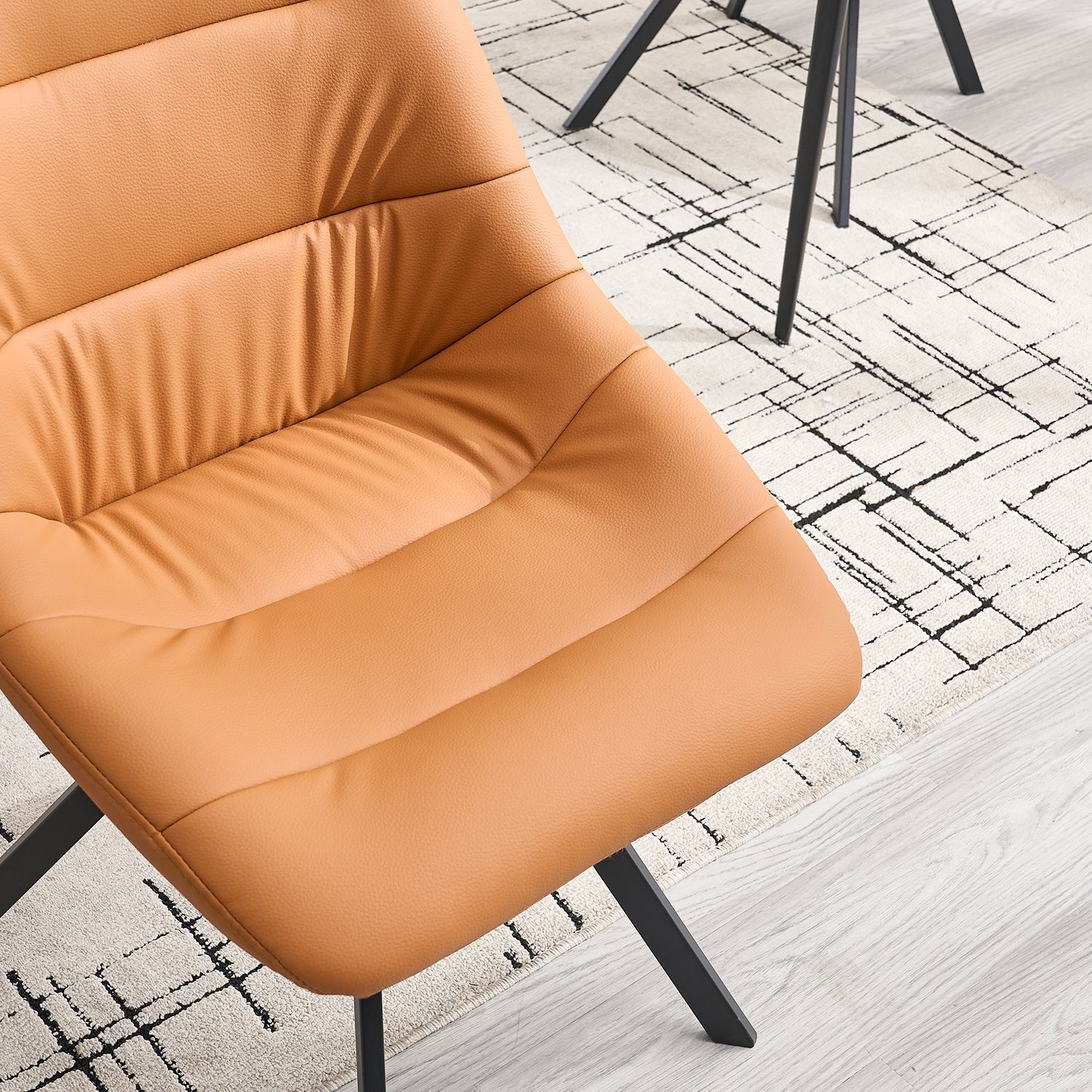 Tan leather accent chair with tufted seat