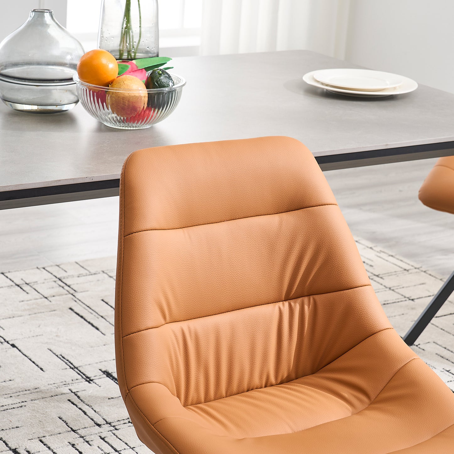 Tan faux leather dining chair with padded seat and back