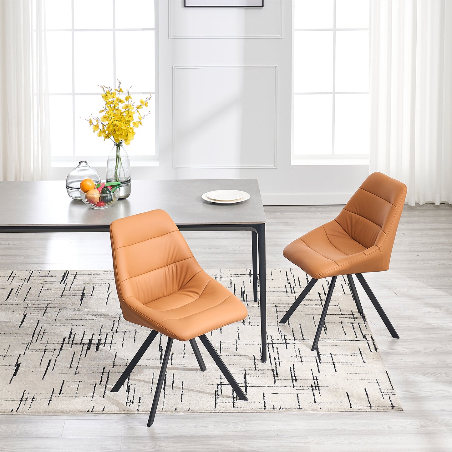 Tan leather dining chair with quilted seat and black metal legs