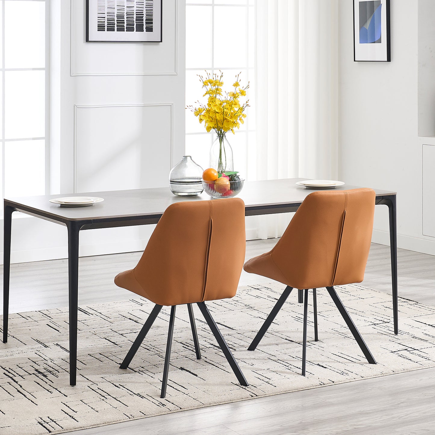 Modern dining chairs in caramel faux leather with black metal legs