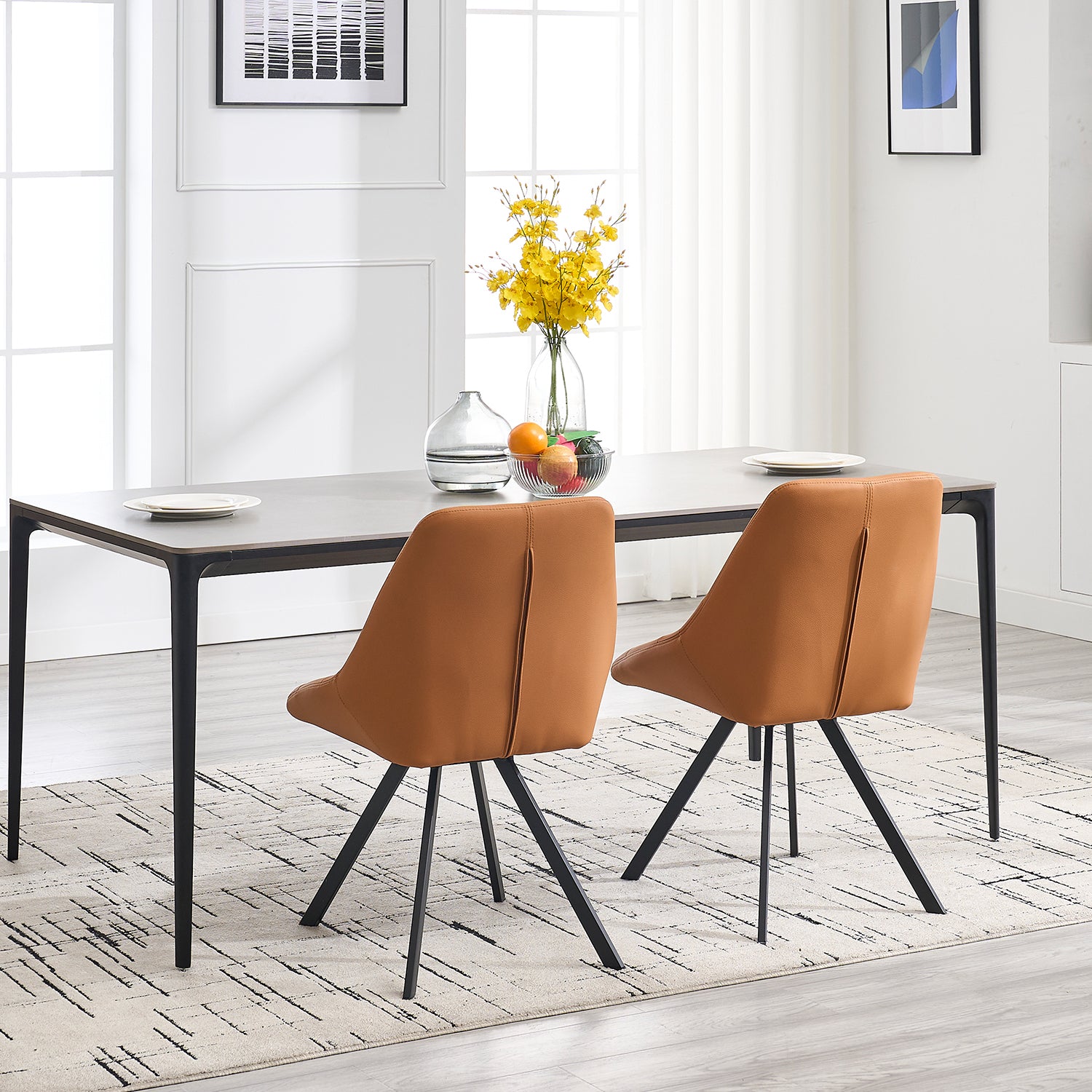 Modern dining chairs in caramel faux leather with black metal legs