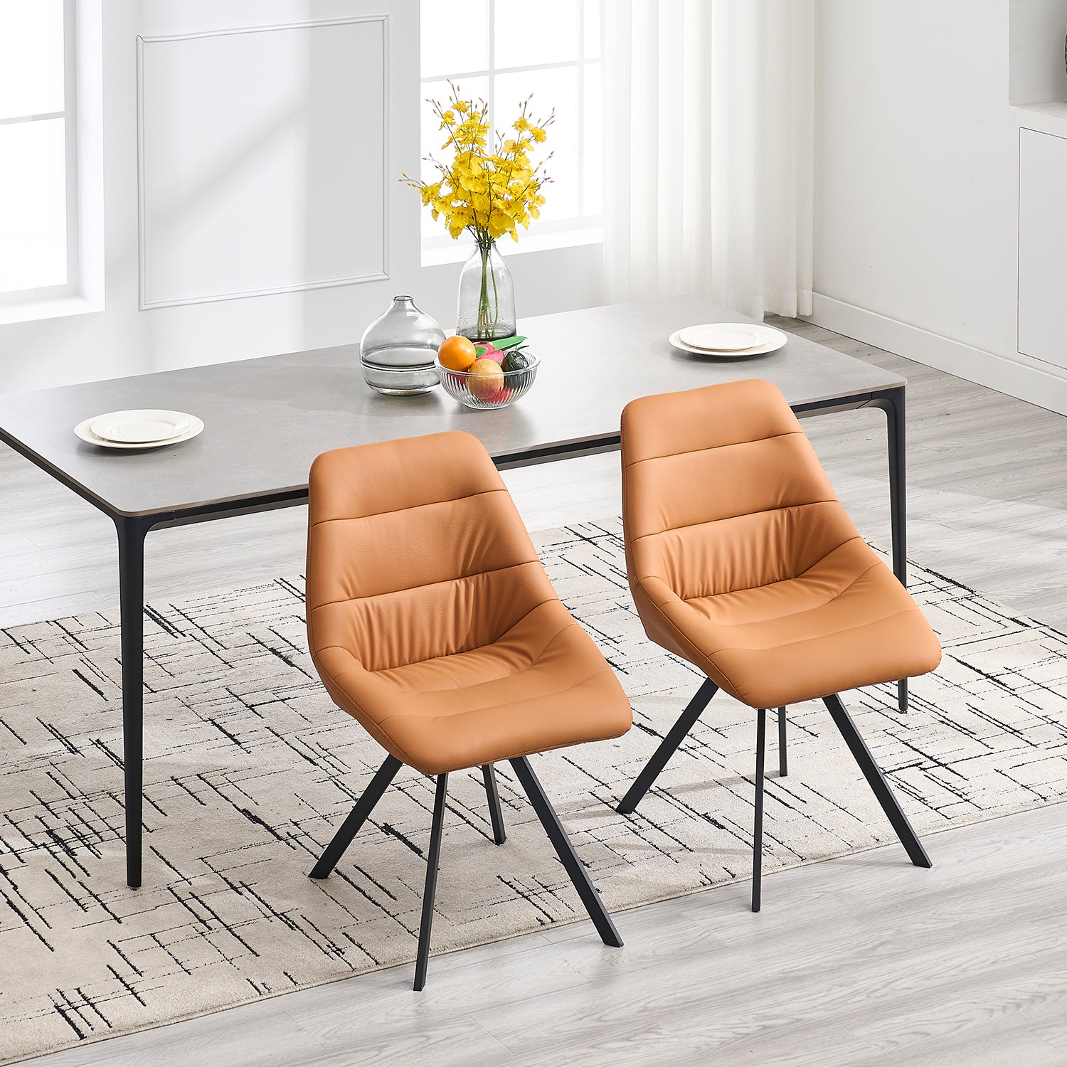 Tan faux leather dining chair with quilted seat and modern black legs