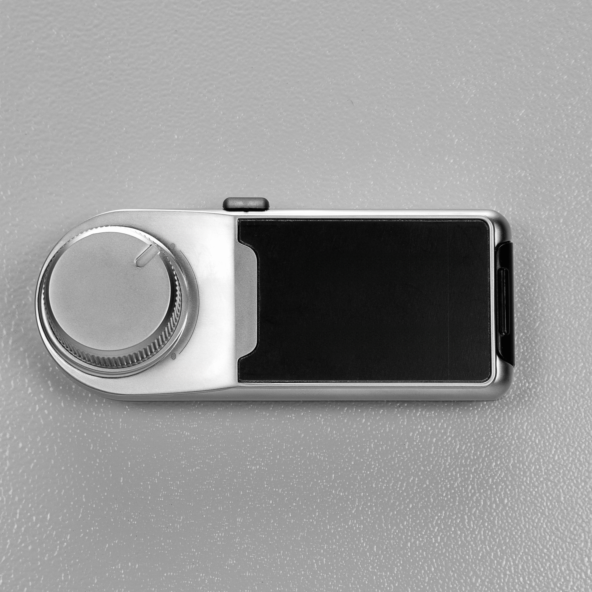 Silver digital safe lock with textured dial for secure entry