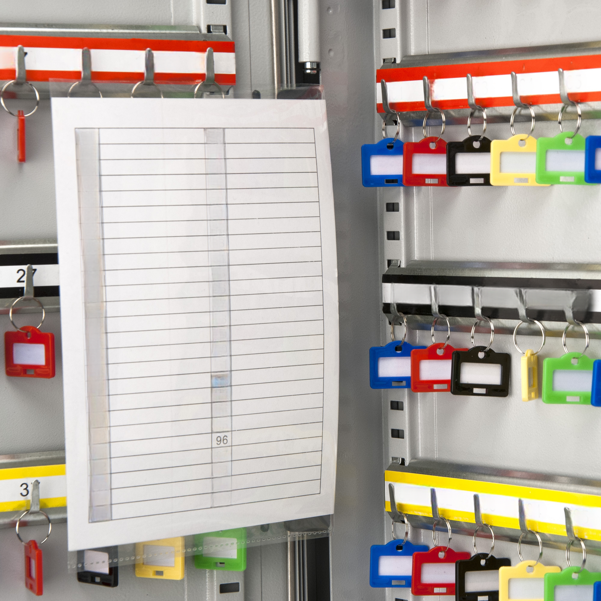 Assorted colored key tags on a key organizer