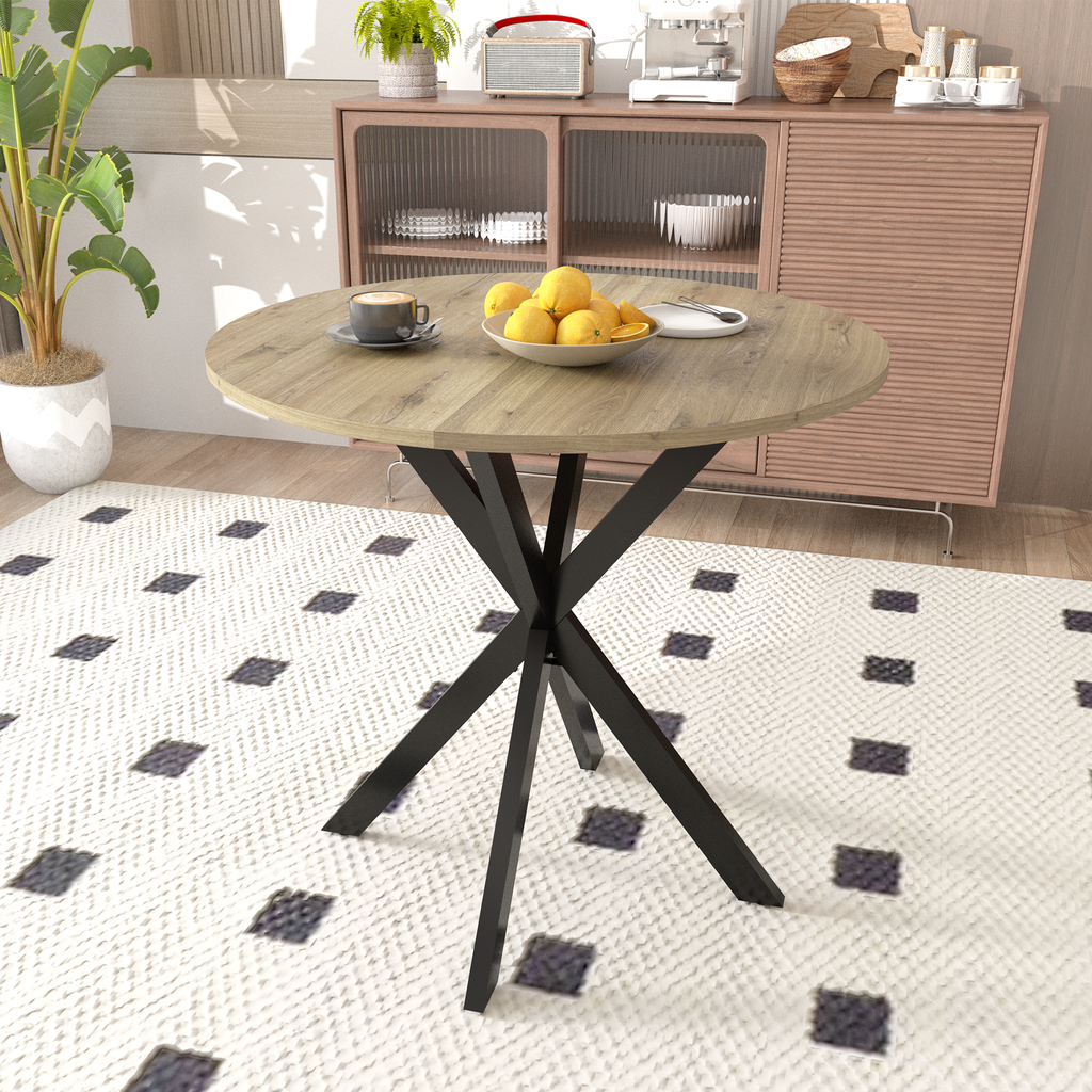 Round oak dining table with black metal pedestal base