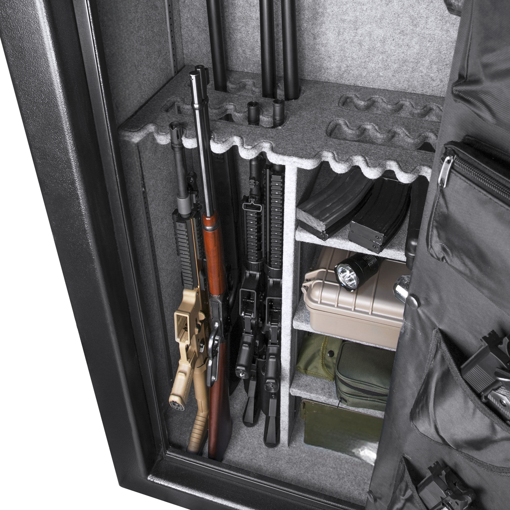 Interior of a gun safe storing rifles and magazines