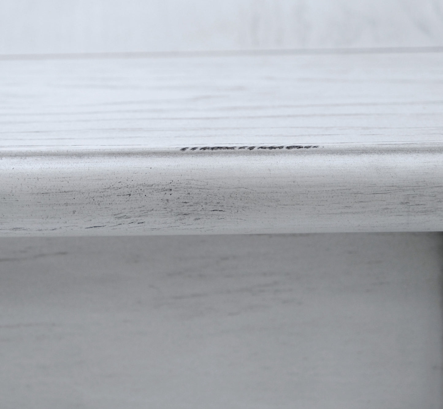 Close up of distressed white wood texture with subtle gray grain