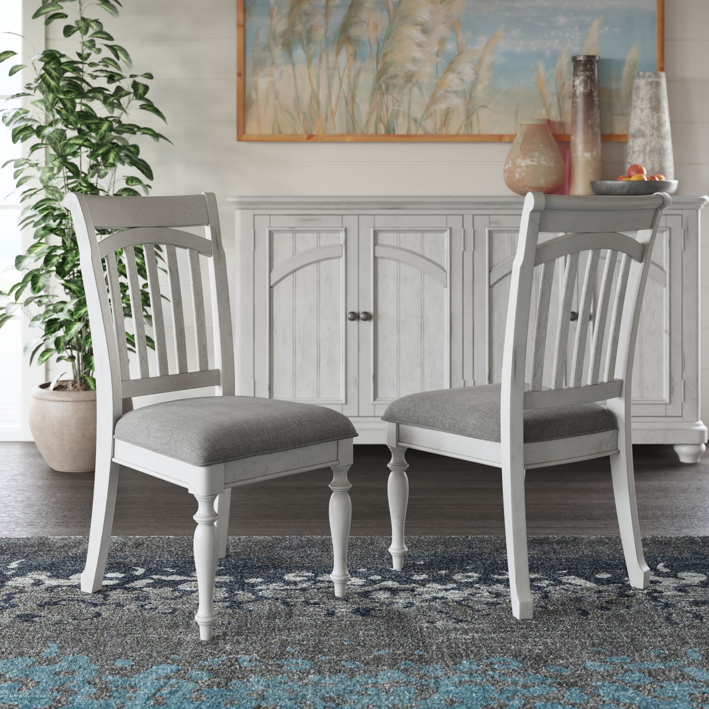 White wooden dining chair with grey upholstered seat and slatted back