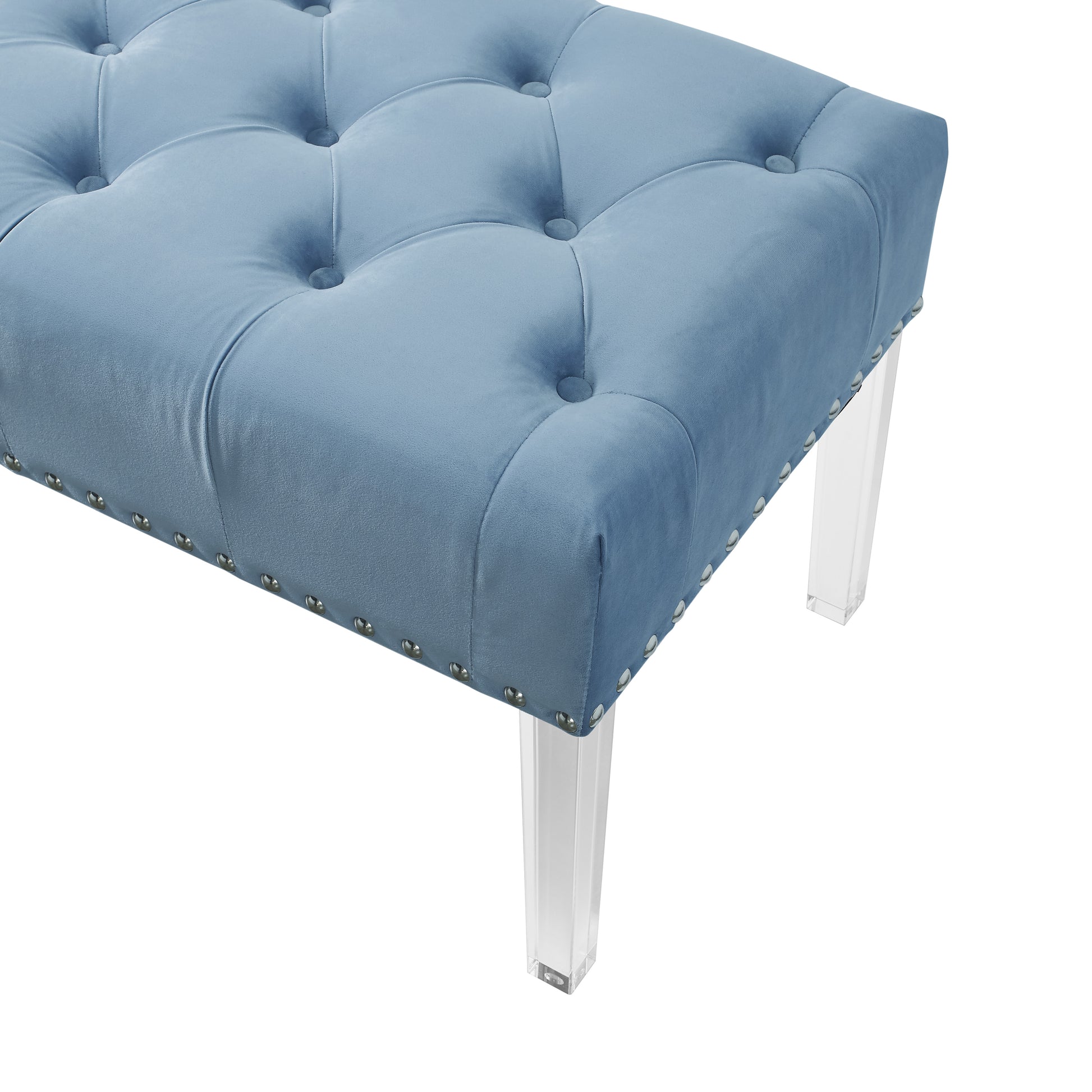 Blue velvet tufted ottoman with silver nailhead trim and clear acrylic legs
