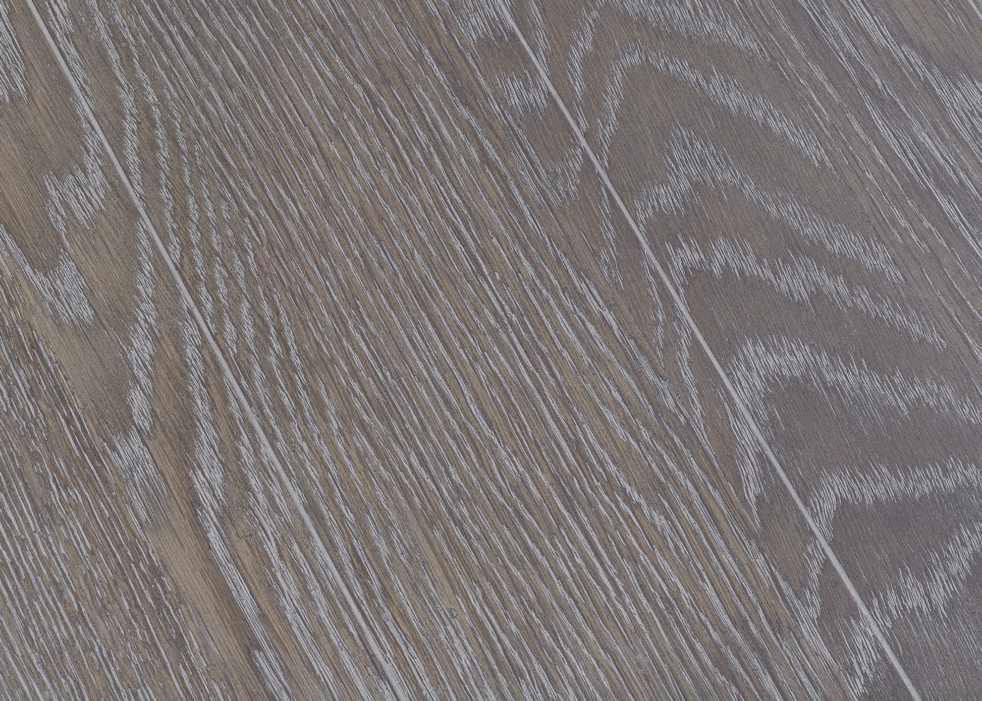 Closeup of distressed grey oak wood grain flooring