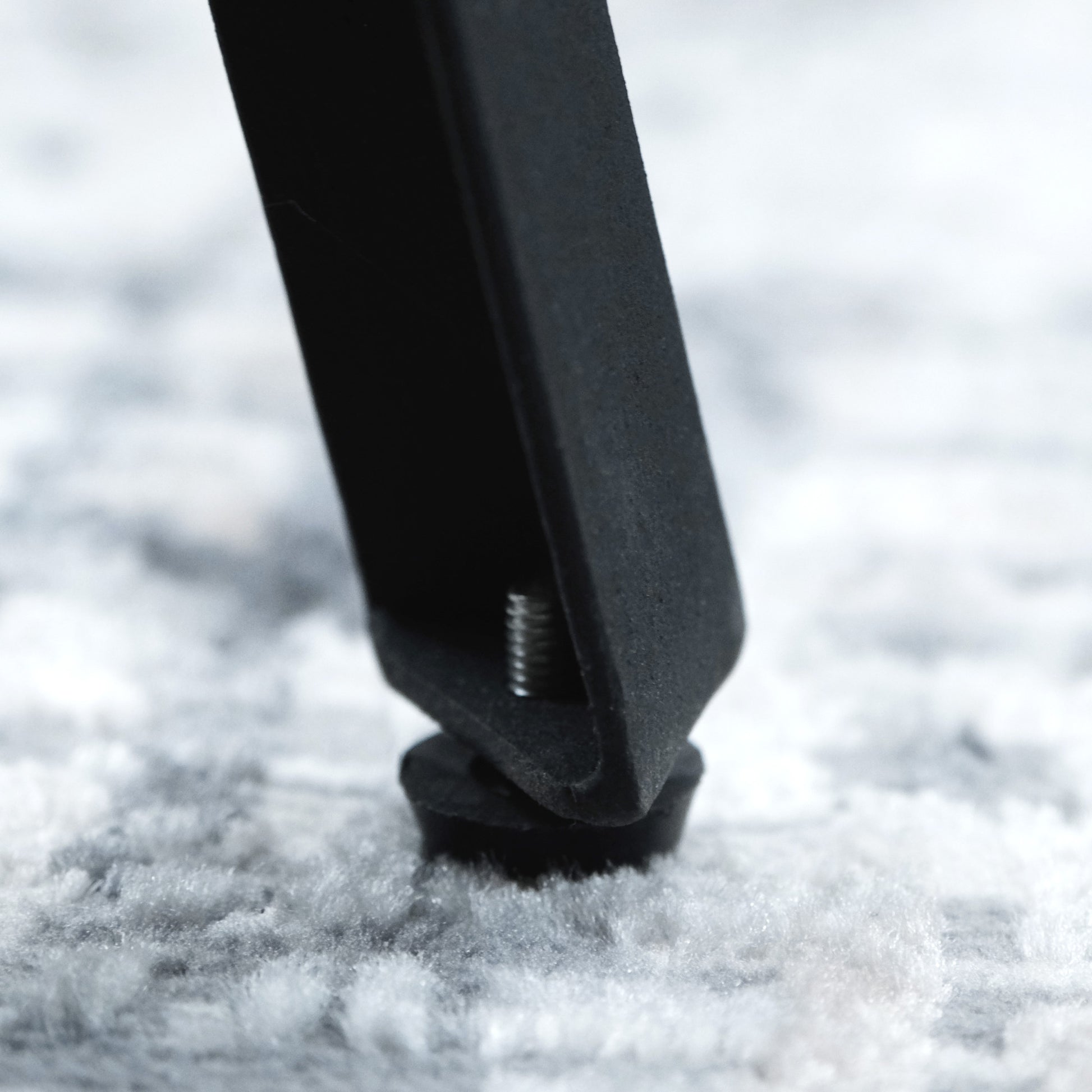 Black metal furniture leg with adjustable leveling foot for stability
