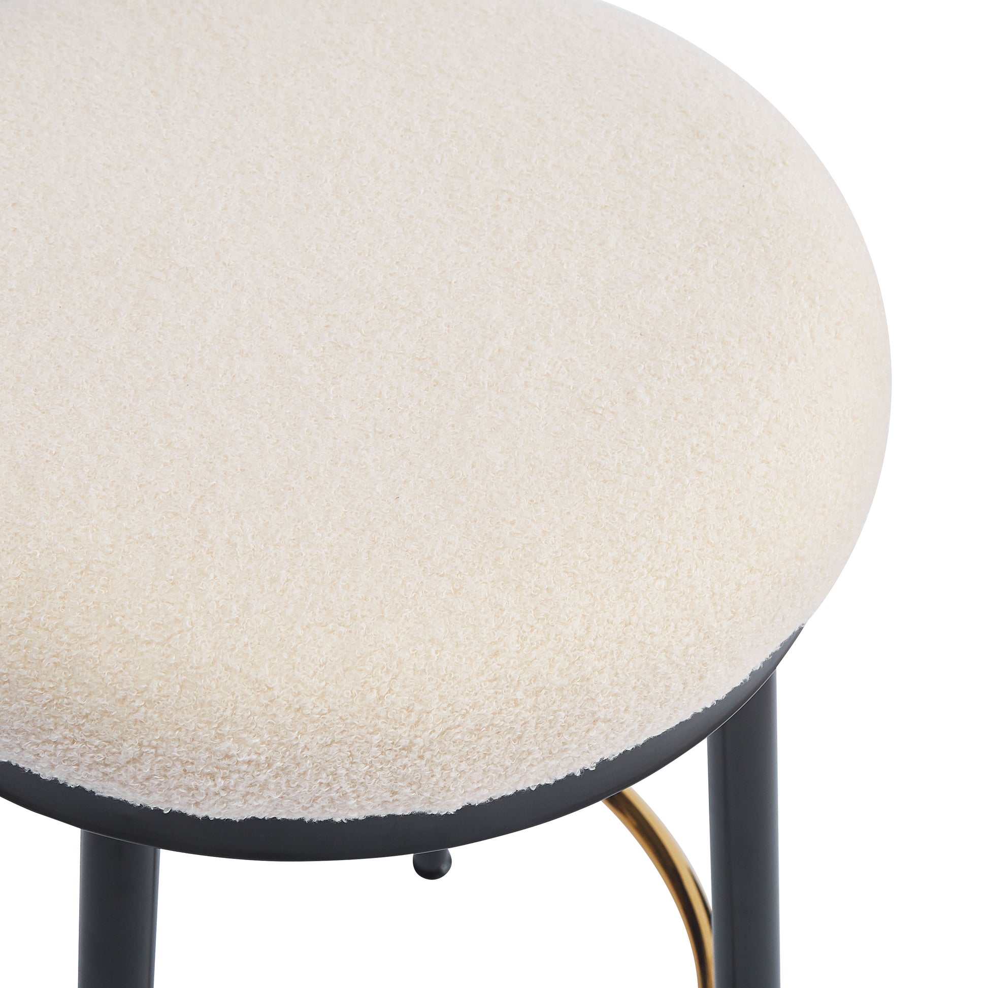 Cream boucle accent stool with black metal legs and gold accents