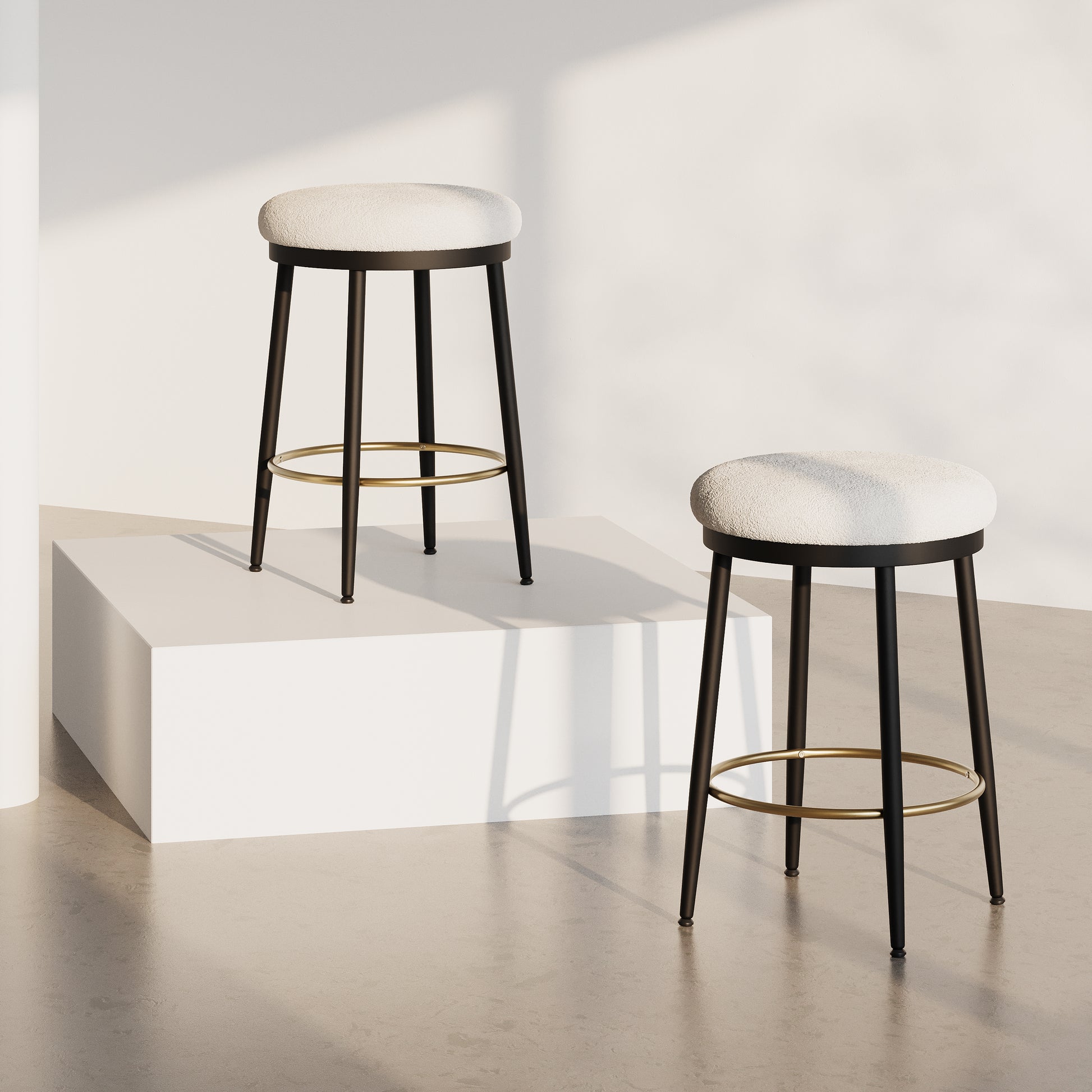 Modern bar stool with a textured white seat and black metal legs with gold footrest