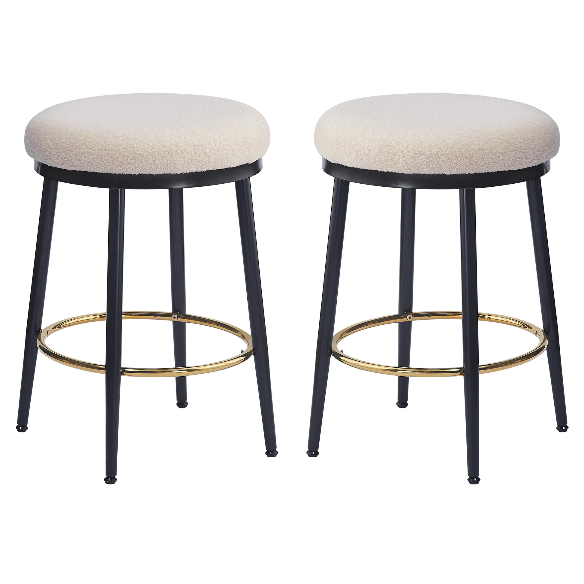 Cream boucle bar stools with black legs and gold footrests