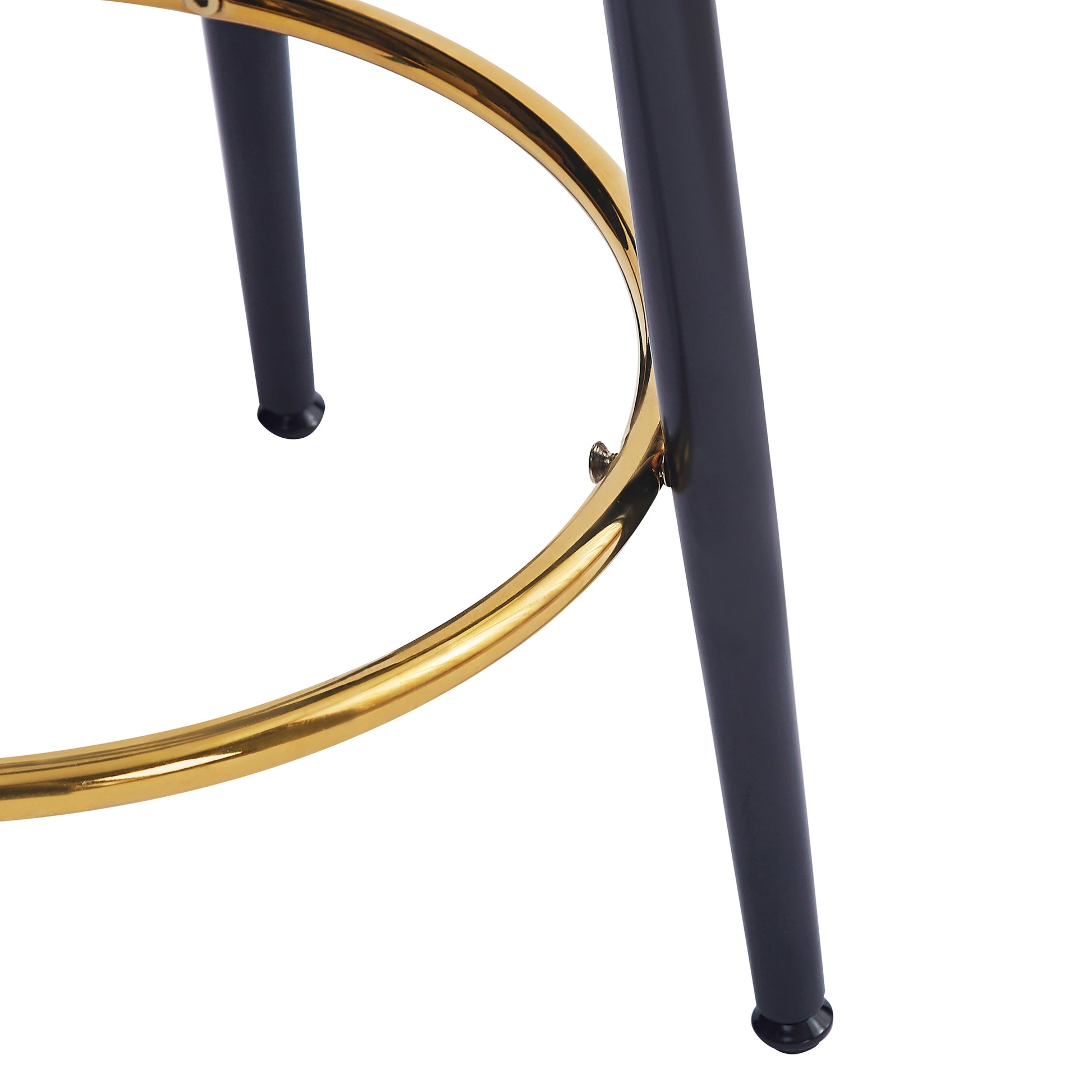 Closeup of a gold metal ring and black stool legs