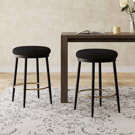 Black upholstered bar stool with gold footrest