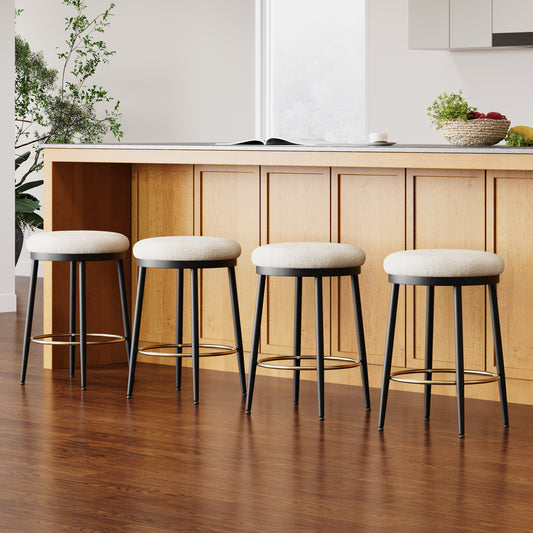 Four modern bar stools with cream boucle seats and black metal legs