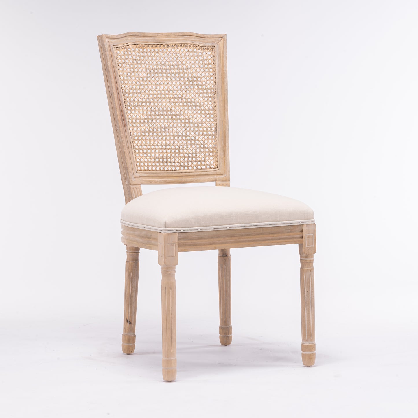 Light wood dining chair with cane back and neutral upholstered seat
