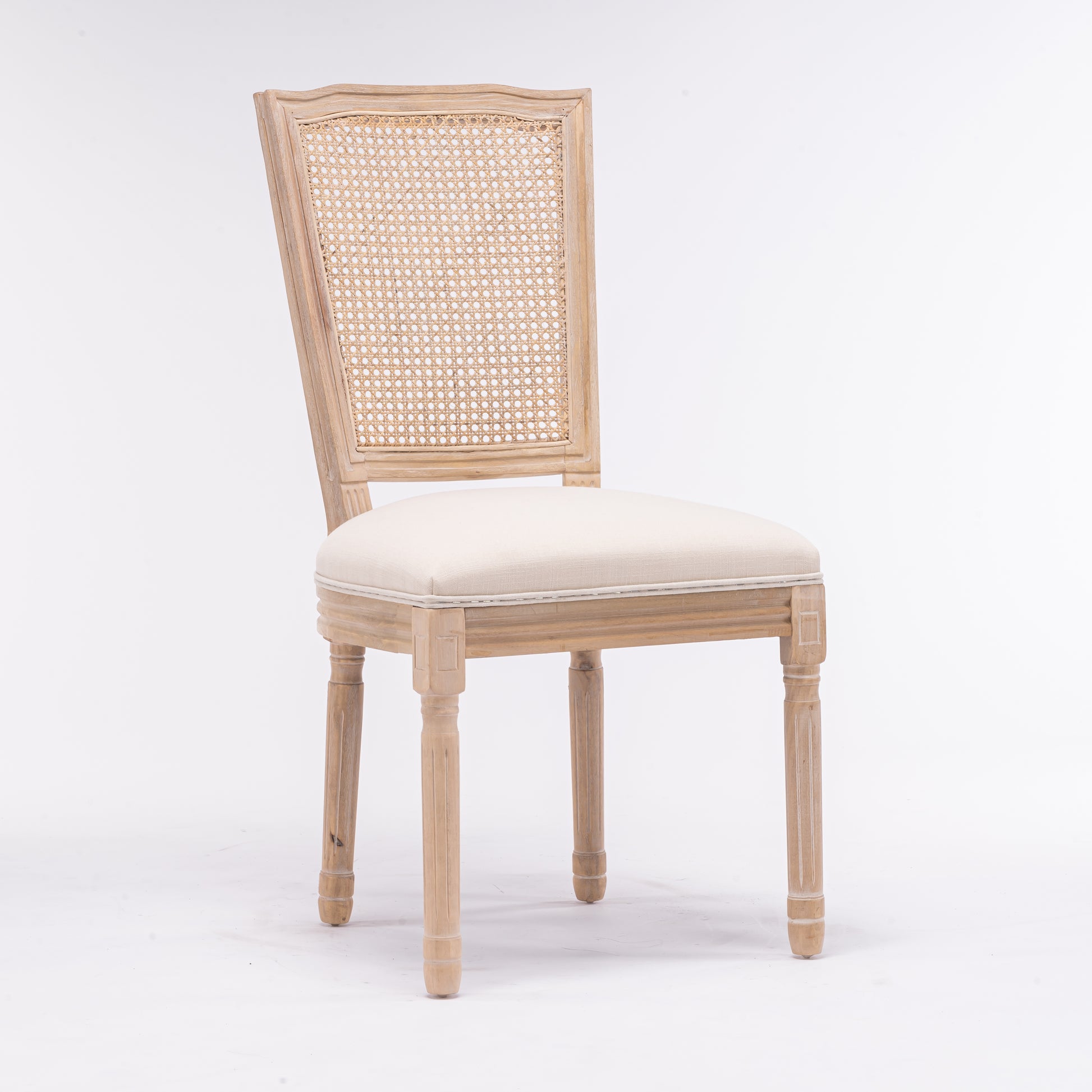 Light wood dining chair with cane back and neutral upholstered seat