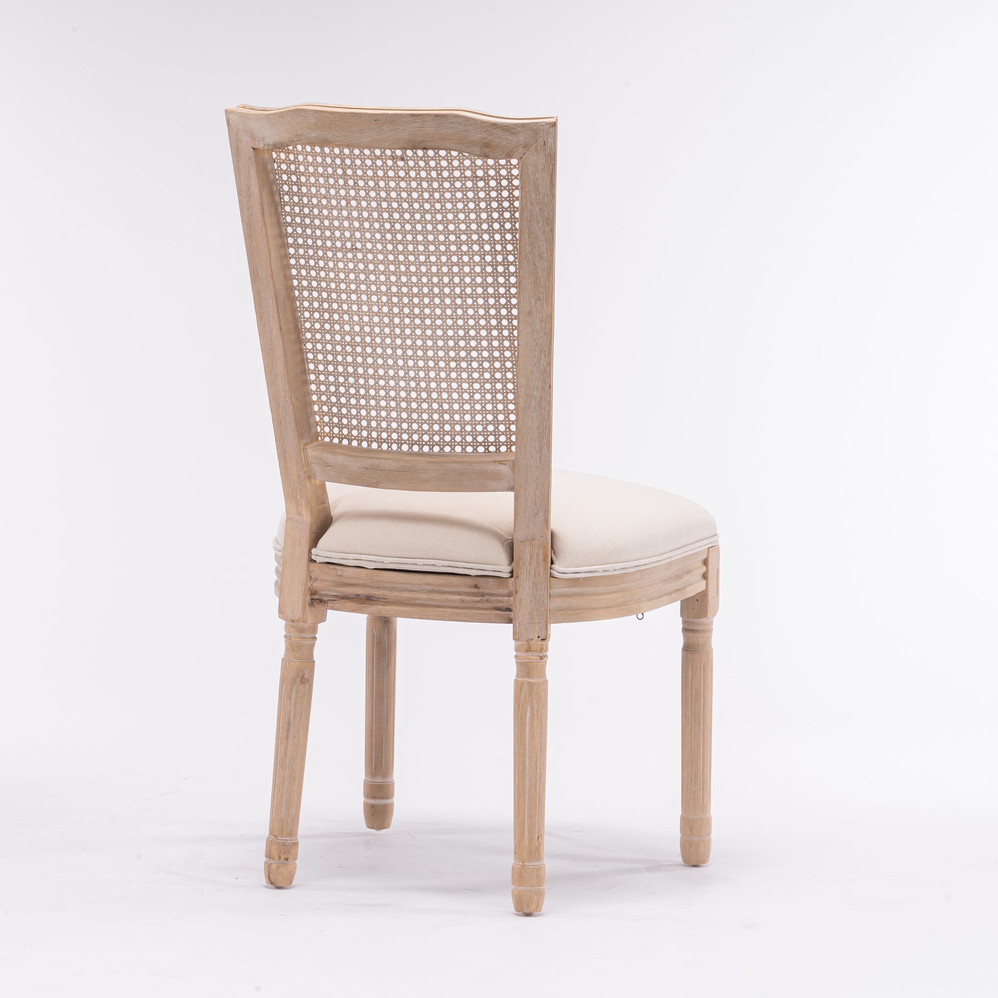 Light oak distressed wood cane chair with neutral upholstered seat