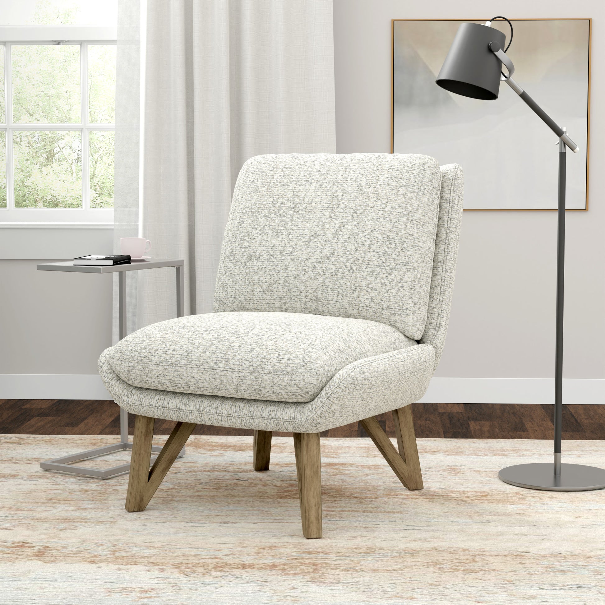 Accent chair in textured light gray fabric with oak legs