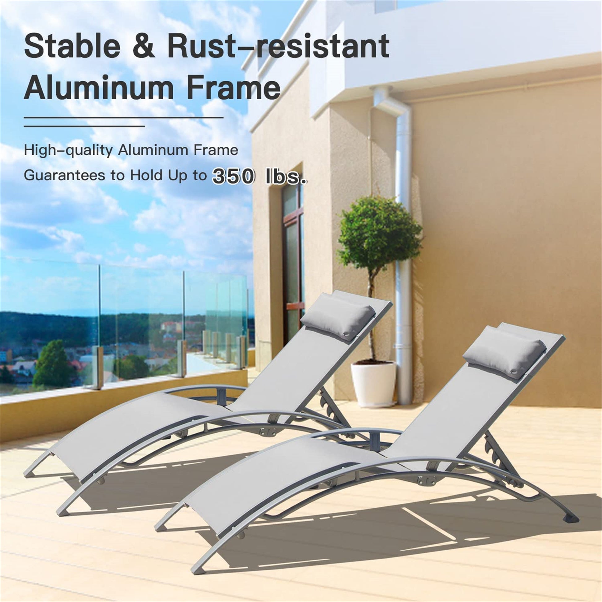 Two grey adjustable lounge chairs with aluminum frames on a patio