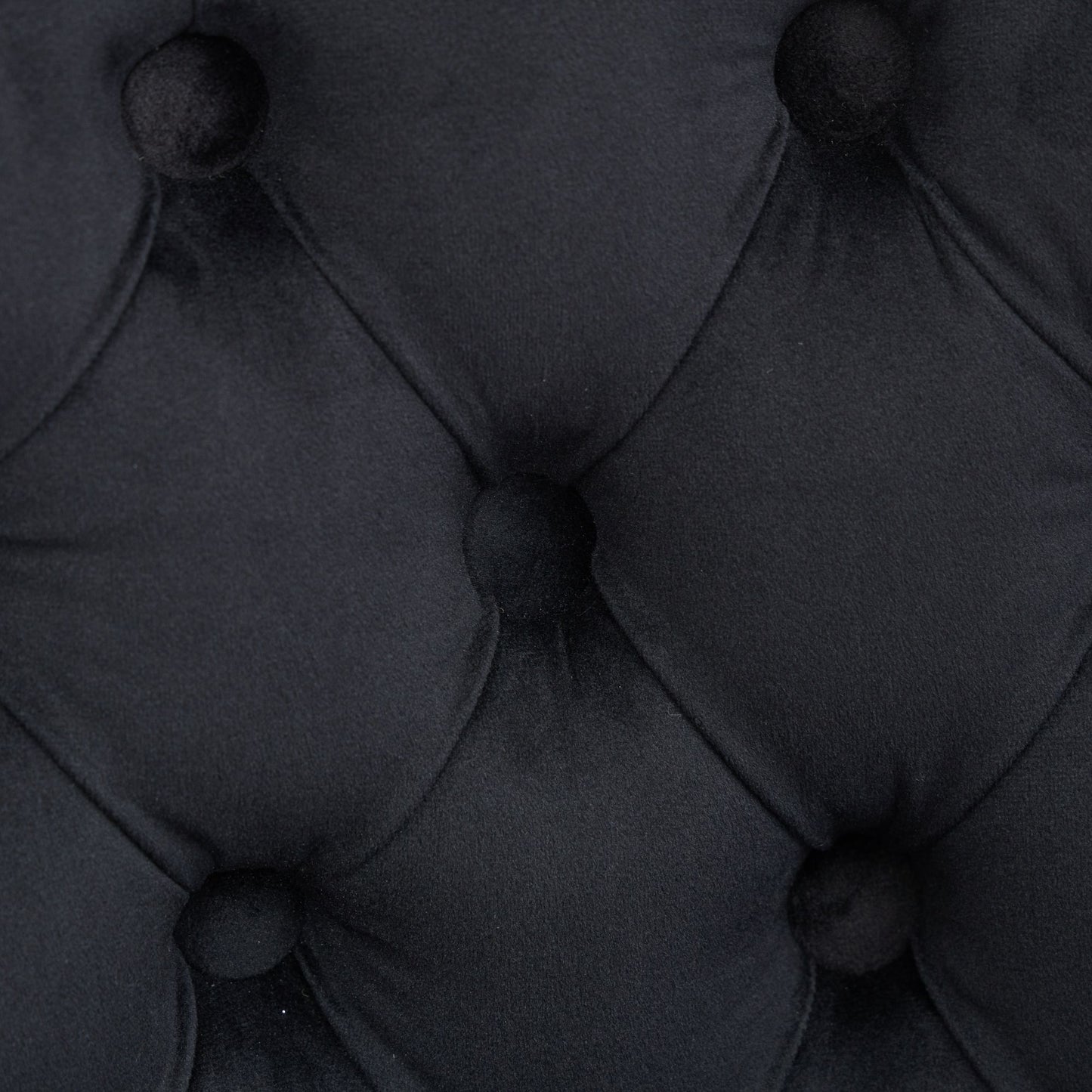 Black velvet upholstery with diamond tufting